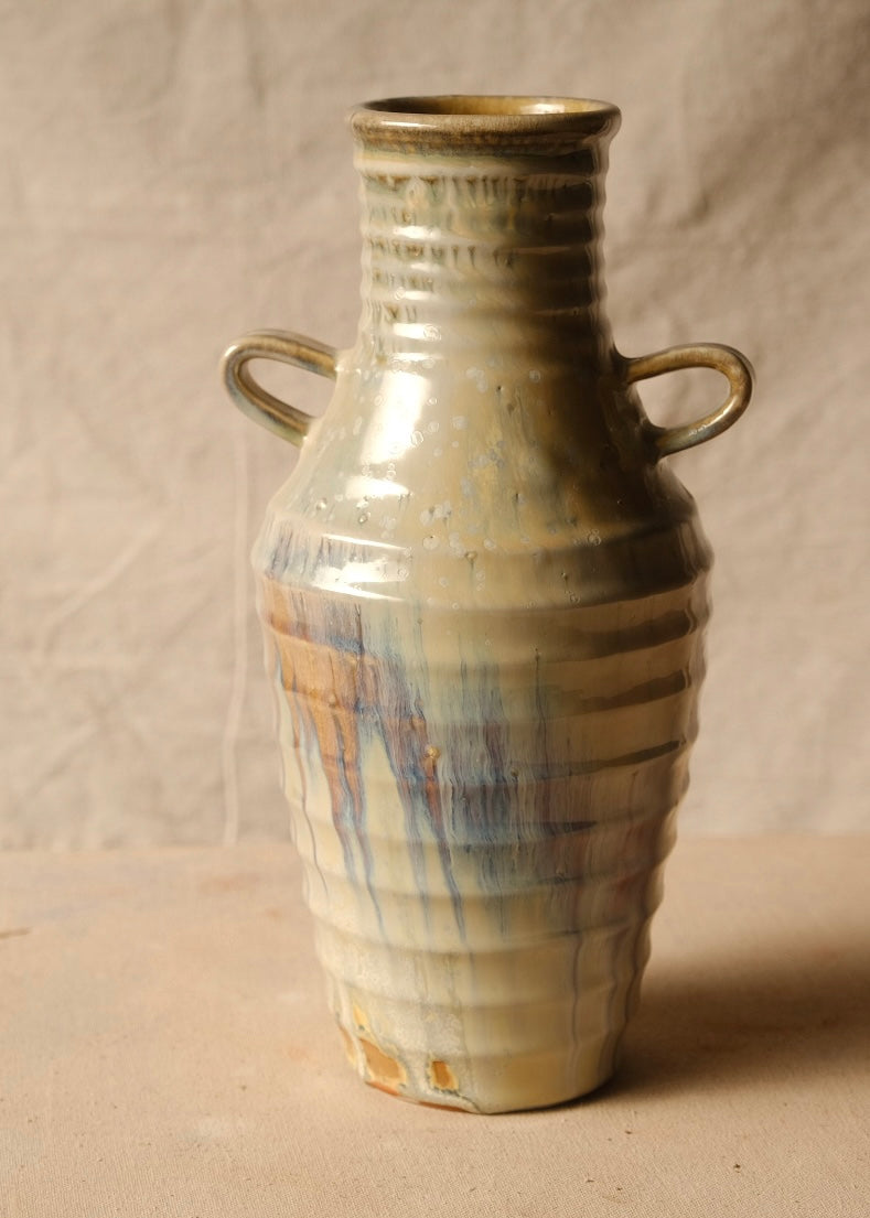 Woodfire Amphora #3 turned to the opposite two-handled view, showing glossy running glaze drips and flashed unglazed base.