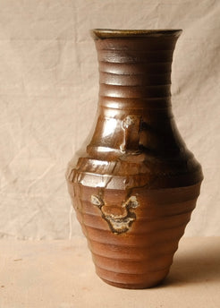 Woodfire Amphora #2, side profile showing a single handle and a rough kiln flash mark on the ribbed lower section.
