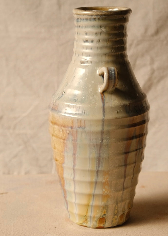 Woodfire Amphora #3 side angle, small handle stub off-center near the neck, ribbed body with vertical glaze drips.