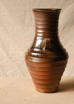 Woodfire Amphora #2, side profile highlighting one handle, horizontal ridge texture, and glossy shoulder glaze.