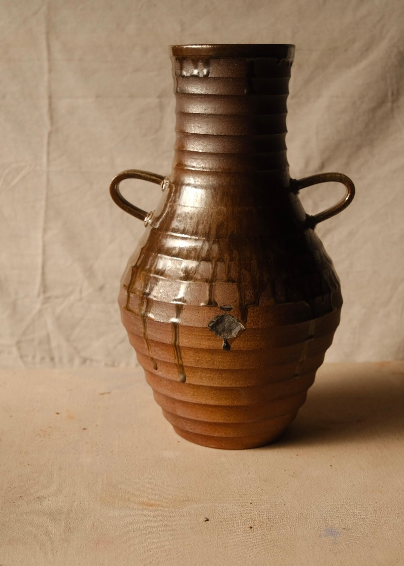 Woodfire Amphora #1, reverse front view displaying two handles and an exposed unglazed diamond patch on the ribbed belly.