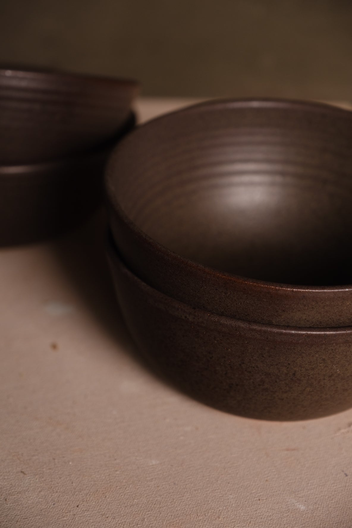 Speckled Buff Ramen Bowl, close angled perspective looking into two nested bowls with ribbed interior walls