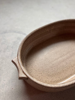 Speckle Maize Hot Dish, high-angle close view looking inside the speckled oval baker and tab handle.