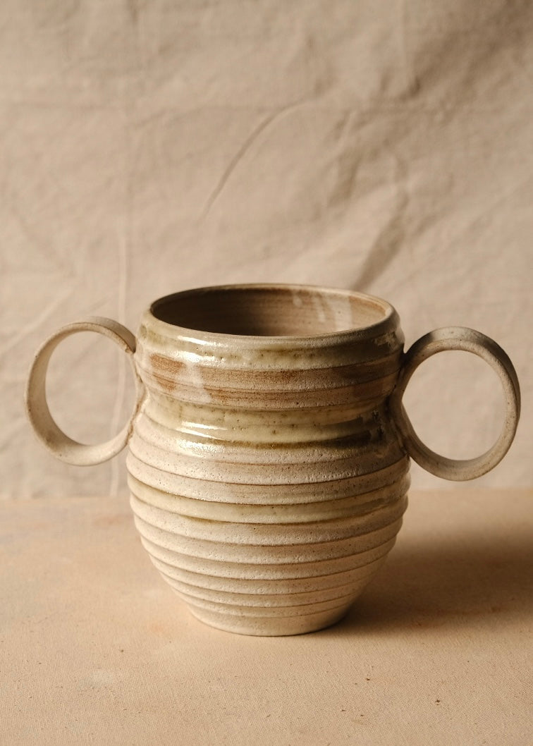 OO Amphora front view showing both wide loop handles, a glazed collar with twin brush marks, and ribbed body.