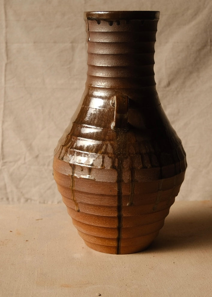 Woodfire Amphora #1, profile view turned ninety degrees to highlight one side handle and a vertical glaze drip run.