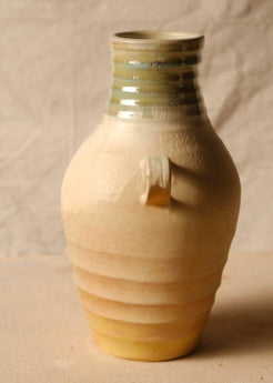 Woodfire Amphora # 4 turned to show a single side handle, horizontally ribbed lower body, and ringed glazed neck.