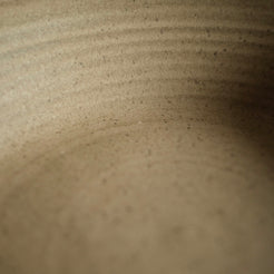 Speckled greyish-tan ceramic glaze with gentle throwing ridges and a smooth matte finish by Settle Ceramics.
