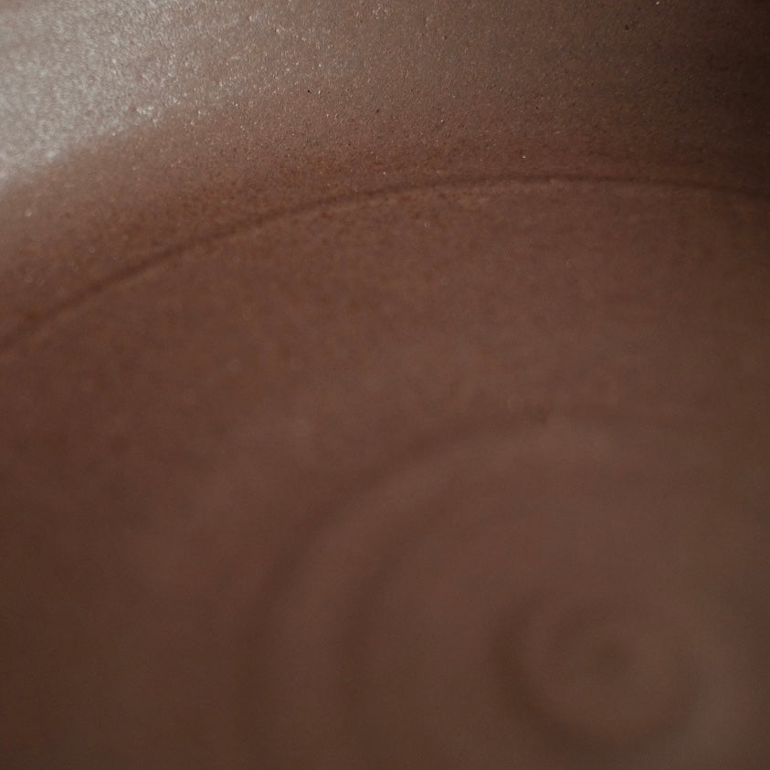 Fat Rim Dinner Plate glaze swatch, close-up of muted brown clay body showing delicate surface grain.