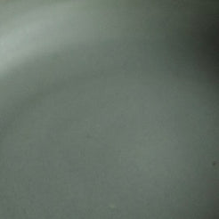 Fat Rim Dinner Plate glaze swatch, close-up detail of smooth muted grey-green satin finish.