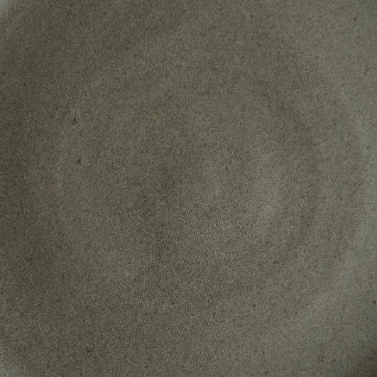 Dark charcoal grey matte glaze with a finely speckled texture and faint throwing rings by Settle Ceramics.