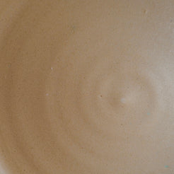 Fat Rim Lunch Plate interior detail displaying a smooth, matte sand-colored clay surface