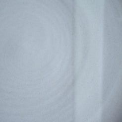 Pale greyish-white matte glaze showing subtle spiral throwing rings and a smooth surface by Settle Ceramics.
