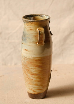 Woodfire Amphora #7, three-quarter profile highlighting one loop handle with wood-fired glaze pooling and unglazed base
