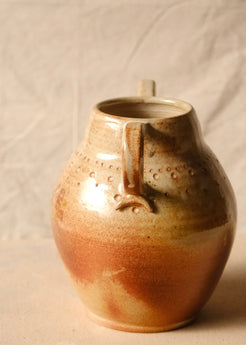 Woodfire Amphora #10, side profile showcasing a single curved handle with decorative applied clay terminal