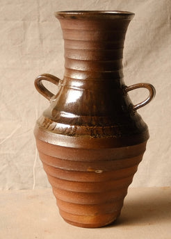 Woodfire Amphora #2, turned front view with two loop handles and glossy glaze over the banded upper body.