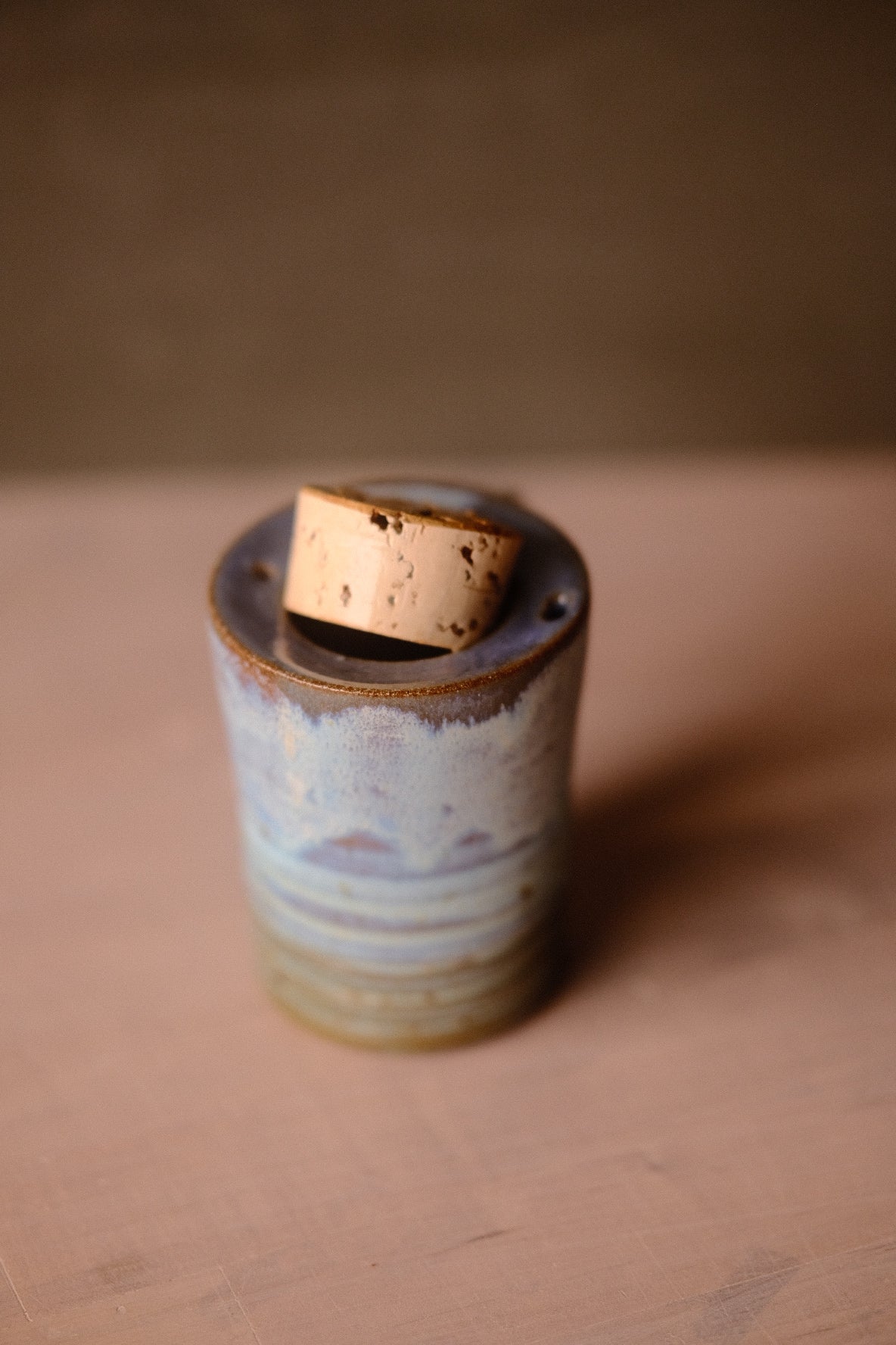 Secret Cenote Traveller Mug viewed from high angle with its thick cork stopper partially lifted out of the recessed opening.