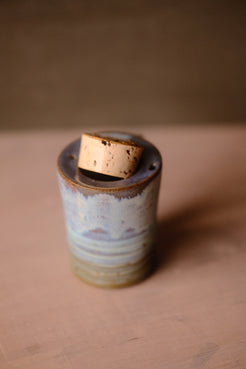 Secret Cenote Traveller Mug viewed from high angle with its thick cork stopper partially lifted out of the recessed opening.