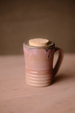 Lavendar Storm Traveller glazed mug with flush cork top and horizontal ridges, turned with handle on the right.