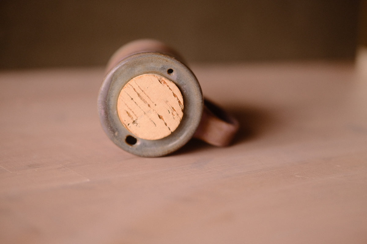 Lavendar Storm Traveller mug seen from above, showing the cork stopper in the recessed lid with sip and air holes.