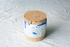Wander Salt Jar in blue paint splatter and drip glaze over white ceramic with fitted cork.